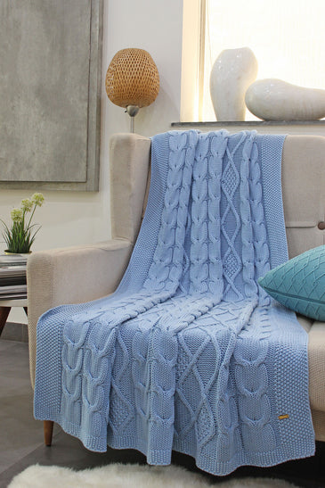 Knitted blue cable texture throw